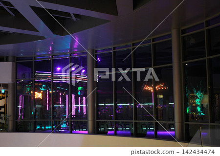 Empty modern interior with neon reflections at night Empty modern interior with neon reflections at night 142434474