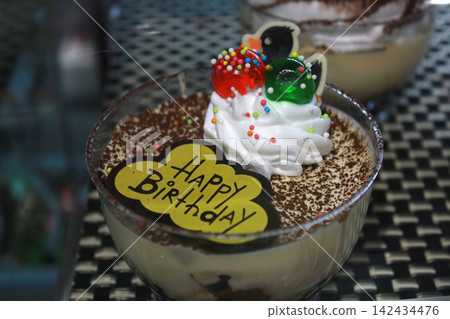Birthday dessert with whipped cream and chocolate Birthday dessert with whipped cream and chocolate 142434476