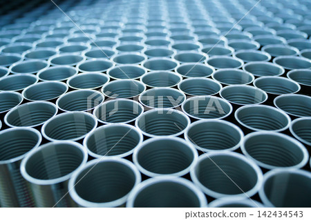 Rows of metal cans on automated production line in food processing plant Rows of metal cans on automated production line in food processing plant 142434543