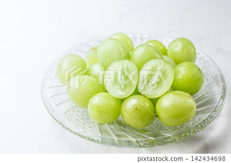 Fresh, vibrant Shine Muscat grapes photographed in high key. Fresh, vibrant Shine Muscat grapes photographed in high key. 142434698