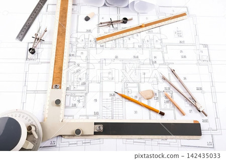 Architectural blueprints with tools and ruler on desk Architectural blueprints with tools and ruler on desk 142435033