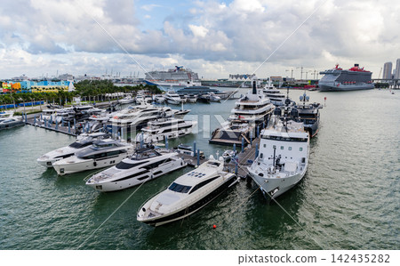 Miami, Florida, USA - November 04, 2024: Docked yacht in port of Miami. Calm marina waters. Port with yacht. Lauderdale marina. Luxury yacht charter. Miami port marina. Luxury yachting in summer Miami, Florida, USA - November 04, 2024: Docked yacht in port of Miami. Calm marina waters. Port with yacht. Lauderdale marina. Luxury yacht charter. Miami port marina. Luxury yachting in summer 142435282