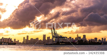 Skyscape with sea horizon. Horizon sunrise sea with ship. Sunrise seascape. Romantic summer vacation seascape. Golden hour. Sea sunset horizon. Sunset cloudy sky. Seascape at summer vacation Skyscape with sea horizon. Horizon sunrise sea with ship. Sunrise seascape. Romantic summer vacation seascape. Golden hour. Sea sunset horizon. Sunset cloudy sky. Seascape at summer vacation 142435308