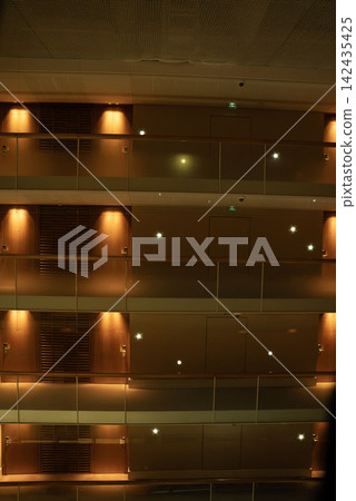 Interior view of a luxury hotel, featuring modern architectural design and a calming color scheme. Interior view of a luxury hotel, featuring modern architectural design and a calming color scheme. 142435425