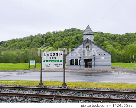 Rails and station sign at the former Shumarinai Station 142435582
