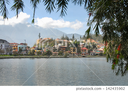 Sapa in Lao Cai Province, Vietnam. View of this northern Vietnamese town with Lake Sapa in the foreground Sapa in Lao Cai Province, Vietnam. View of this northern Vietnamese town with Lake Sapa in the foreground 142435902