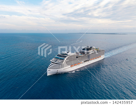 Aerial view luxury liner. Ship leaving Miami beach port. Cruise ship vacation. Aerial view cruise ship on summer vacation tour. Cruise ship vacation and travel by sea. Voyage across sea Aerial view luxury liner. Ship leaving Miami beach port. Cruise ship vacation. Aerial view cruise ship on summer vacation tour. Cruise ship vacation and travel by sea. Voyage across sea 142435957
