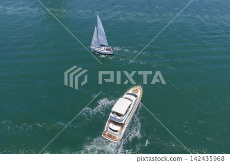 Yacht boat tour. Luxury boat yachting. Motorboat sailing at sea. Luxury private yacht in sea. Motor yacht luxury vessel. Boat motor aerial. Vacation on summer. Aerial view motorboat Yacht boat tour. Luxury boat yachting. Motorboat sailing at sea. Luxury private yacht in sea. Motor yacht luxury vessel. Boat motor aerial. Vacation on summer. Aerial view motorboat 142435968