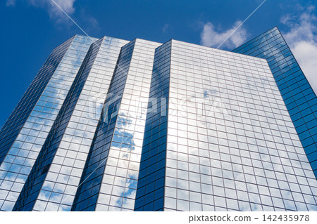 Perspective skyscraper. Minimalist glass architecture. Business skyscraper building. Architectural building business area. Glass skyscraper. City architecture. Architecture of office building Perspective skyscraper. Minimalist glass architecture. Business skyscraper building. Architectural building business area. Glass skyscraper. City architecture. Architecture of office building 142435978