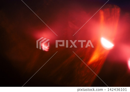 Red light effect on black background. Abstract wallpaper. Analog film effect. Blurred defocused. Lo-fi effect Red light effect on black background. Abstract wallpaper. Analog film effect. Blurred defocused. Lo-fi effect 142436101