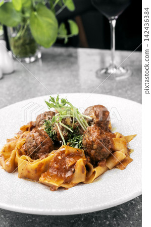 Prupetti sicilan Polpette In Sugo meatballs in ragu tomato sauce with Pappardelle pasta in Sicily restaurant Prupetti sicilan Polpette In Sugo meatballs in ragu tomato sauce with Pappardelle pasta in Sicily restaurant 142436384