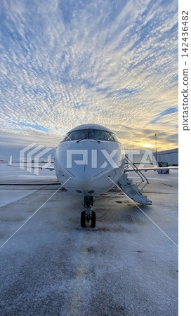 Front View of Passenger Airplane at Sunset, Vertical Photograph Front View of Passenger Airplane at Sunset, Vertical Photograph 142436482