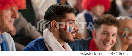 French football fans celebrating their team's victory at stadium. 142436852