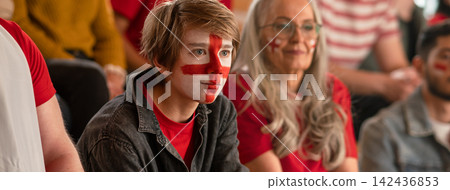 Excited football fans supproting English national team in live soccer match at stadium. Excited football fans supproting English national team in live soccer match at stadium. 142436853