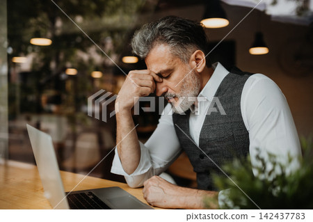 Portrait of pensive mature manager. Portrait of pensive mature manager. 142437783