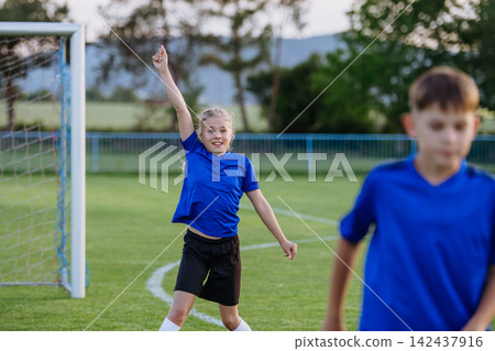 Young football players playing a competitive training match. Young football players playing a competitive training match. 142437916