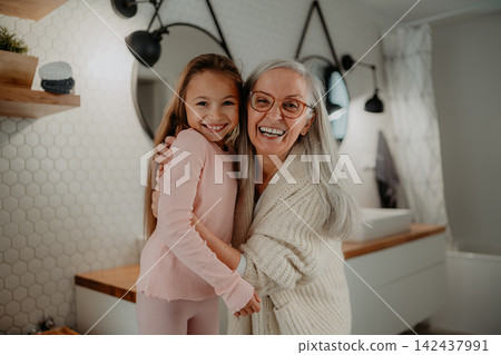 Grandmother taking care of granddaughter during summer break. Grandmother taking care of granddaughter during summer break. 142437991