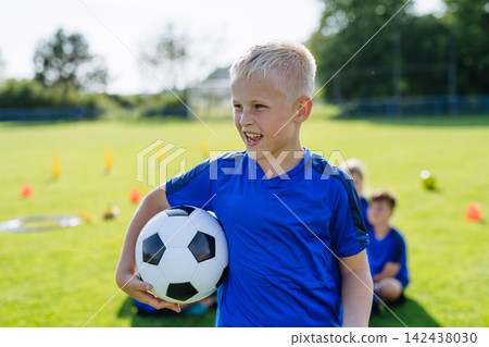 Children football player during youth football training. Children football player during youth football training. 142438030