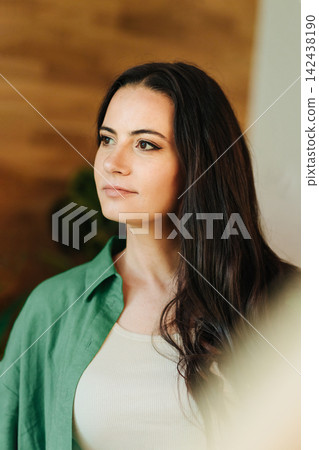 Portrait of smiling woman enjoying a peaceful moment at home Portrait of smiling woman enjoying a peaceful moment at home 142438190