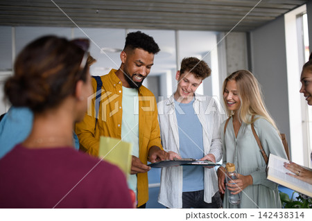 Young university friends hanging out between lectures. Young university friends hanging out between lectures. 142438314