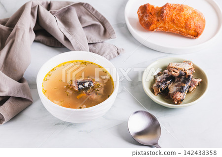 Delicious canned sardine soup in a bowl on the table Delicious canned sardine soup in a bowl on the table 142438358