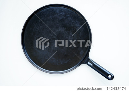 Cast iron crepe pan used for making authentic crepes and galettes. Cast iron crepe pan used for making authentic crepes and galettes. 142438474