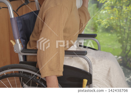 Senior woman living in a wheelchair at home Senior woman living in a wheelchair at home 142438706