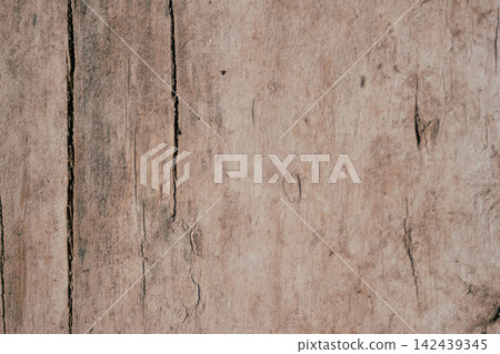 Close-up showing natural rustic wood grain texture background with vertical lines, cracks, and imperfections, highlighting aged timber surface details and abstract patterns Close-up showing natural rustic wood grain texture background with vertical lines, cracks, and imperfections, highlighting aged timber surface details and abstract patterns 142439345