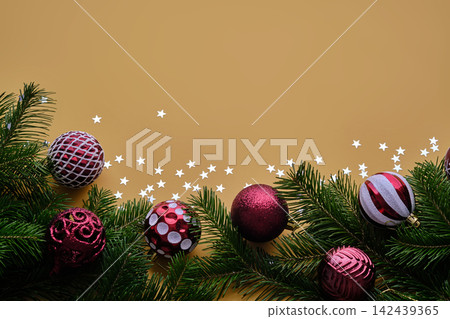 Christmas new year yellow background. Place for the text in Christmas decoration. Christmas new year yellow background. Place for the text in Christmas decoration. 142439365