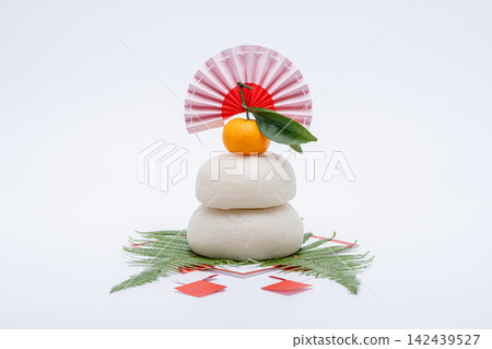 A photograph with a real mochi rice cake ("kagami mochi") placed in the center, against a white background, without a sanbo (stand). A photograph with a real mochi rice cake ("kagami mochi") placed in the center, against a white background, without a sanbo (stand). 142439527