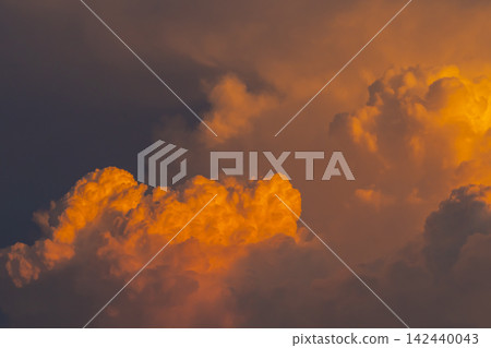 Cumulonimbus clouds illuminated by the setting sun a-1 Cumulonimbus clouds illuminated by the setting sun a-1 142440043