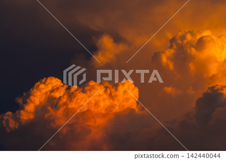 Cumulonimbus clouds illuminated by the setting sun a-2 High saturation contrast Cumulonimbus clouds illuminated by the setting sun a-2 High saturation contrast 142440044