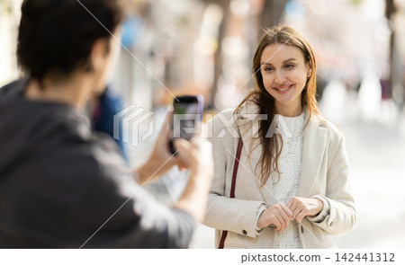 Girl poses during amateur shoot on street Girl poses during amateur shoot on street 142441312