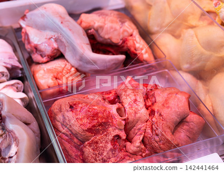 Raw lungs in tray displayed in store meat counter Raw lungs in tray displayed in store meat counter 142441464