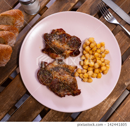 Cooked beef meat with chickpeas on a plate top view Cooked beef meat with chickpeas on a plate top view 142441805