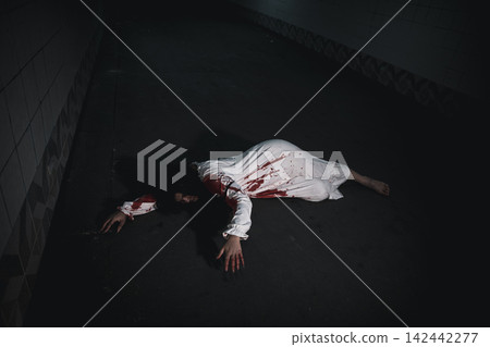 The girl was hit by a car and lying died on the road The girl was hit by a car and lying died on the road 142442277