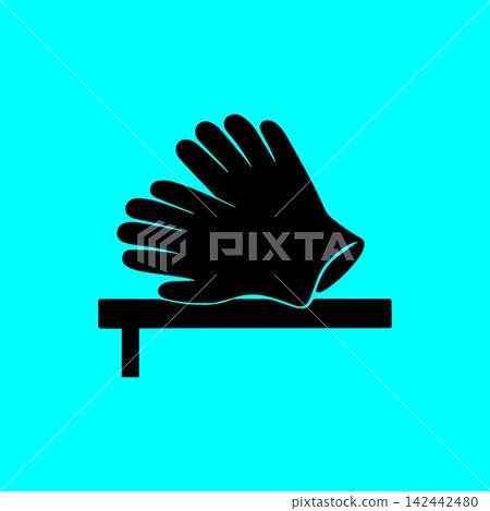 Black silhouette of safety gloves on wooden workbench for protection icon. 142442480