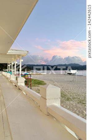 Sunset on the beach and pier - Magic hour floating on the Okinawan coast Sunset on the beach and pier - Magic hour floating on the Okinawan coast 142442615