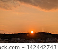 sunset over a residential area 142442743