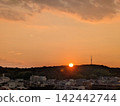 sunset over a residential area 142442744