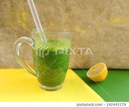 green smoothie in a glass green smoothie in a glass 142443179