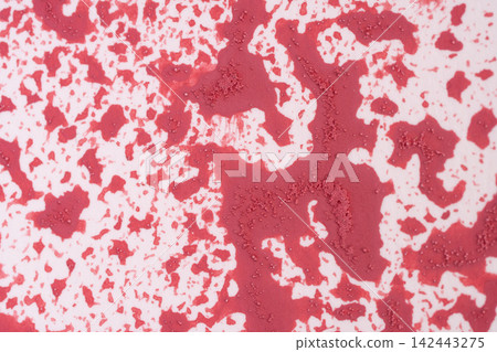 An irregular New Year's pattern utilizing varying shades of red and a granular texture. An irregular New Year's pattern utilizing varying shades of red and a granular texture. 142443275