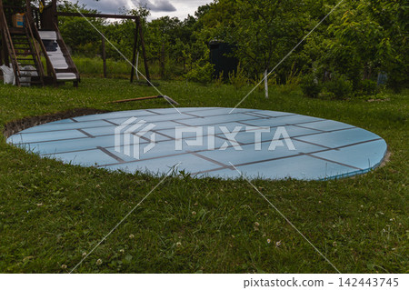 Proper way to set up a swimming pool base in the backyard for installation Proper way to set up a swimming pool base in the backyard for installation 142443745