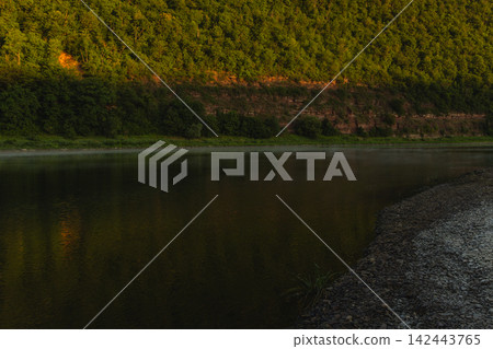 Majestic river meander in a canyon at sunset with green hills in Ukraine Majestic river meander in a canyon at sunset with green hills in Ukraine 142443765