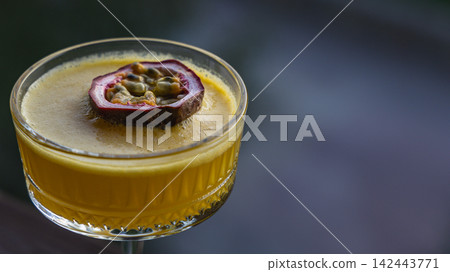 Refreshing pornstar martini served in a cocktail glass with a garnish Refreshing pornstar martini served in a cocktail glass with a garnish 142443771