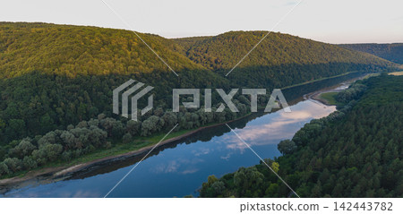 Dniester River flowing through canyon landscape in Ukraine during summer Dniester River flowing through canyon landscape in Ukraine during summer 142443782