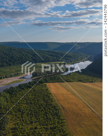 Majestic view of Dniester River winding through green hills in Ukraine Majestic view of Dniester River winding through green hills in Ukraine 142443796