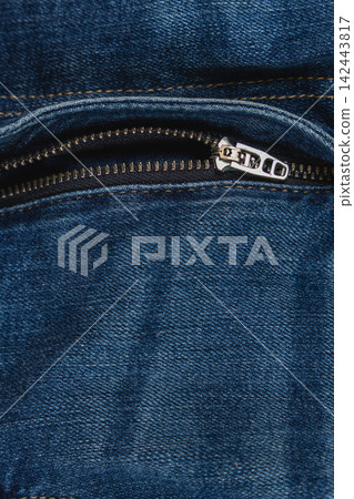 Closeup of denim fabric with zipper detail on pocket of casual jeans Closeup of denim fabric with zipper detail on pocket of casual jeans 142443817
