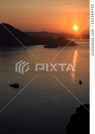 The beauty of the sunrise on Padar Island in West Manggarai, Flores, Indonesia, with reddish-yellow sunlight. The beauty of the sunrise on Padar Island in West Manggarai, Flores, Indonesia, with reddish-yellow sunlight. 142444748
