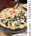 Delicious, freshly baked homemade pizza 142444921